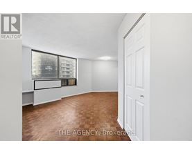 A room with a window and a door.