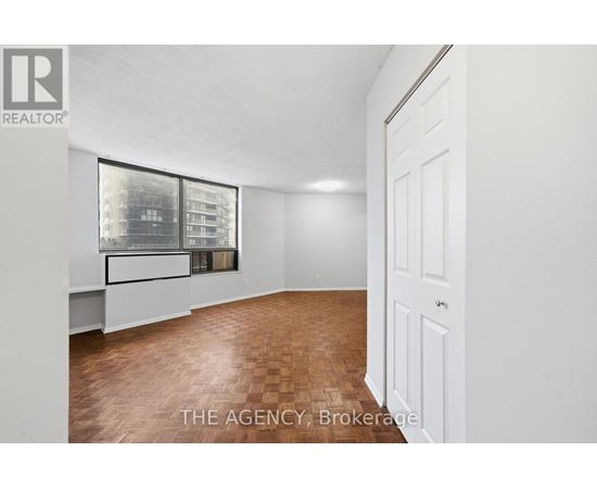 A room with a window and a door.