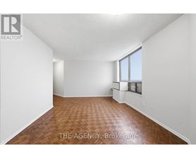 A room with a wooden floor and white walls.