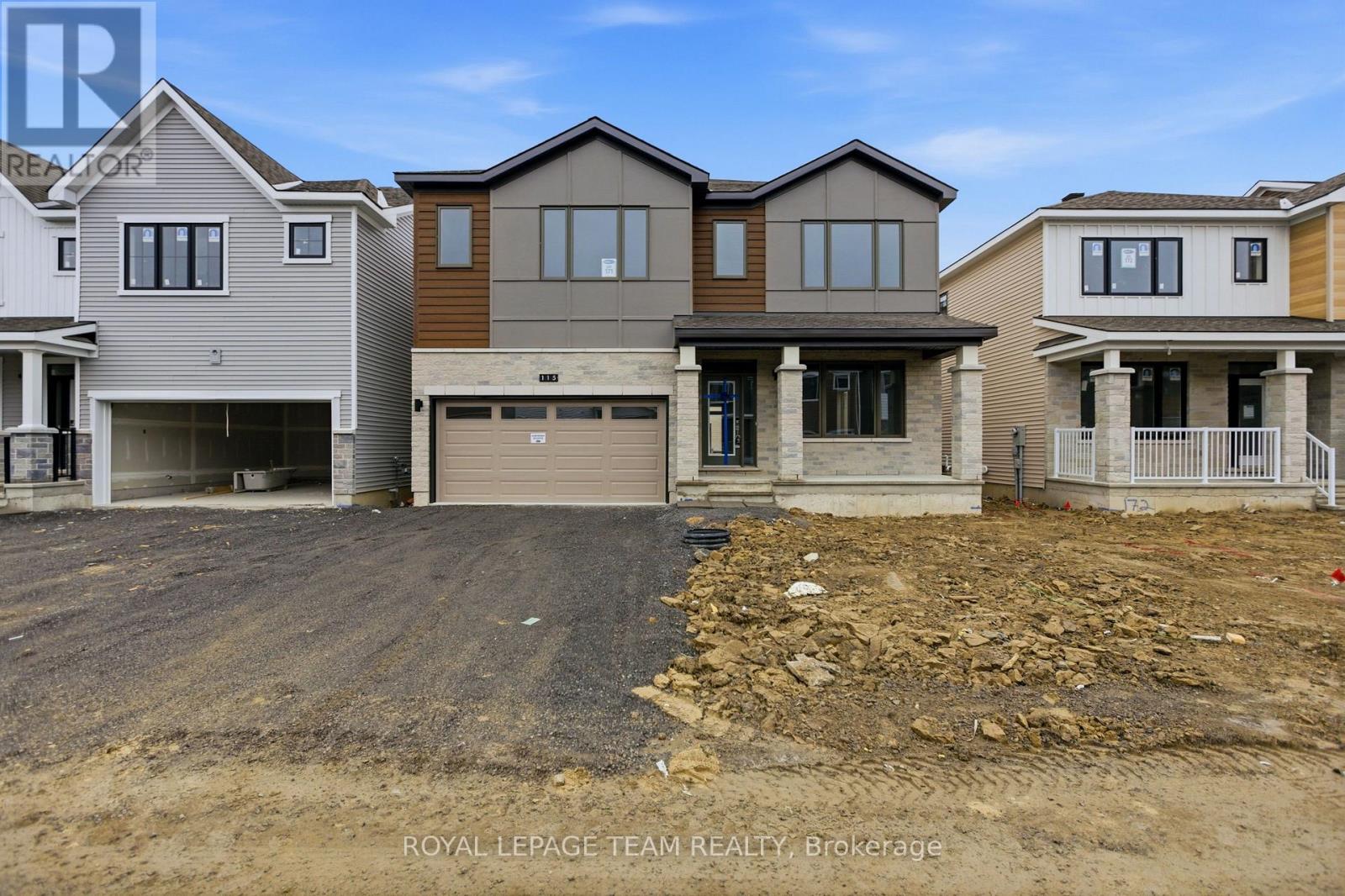 A real estate photo of a house with a garage.