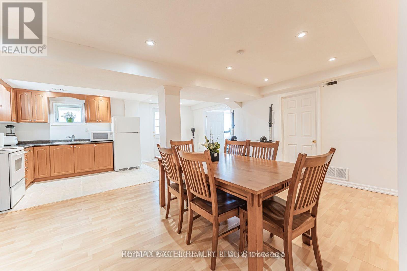 A dining room with a table set for six.