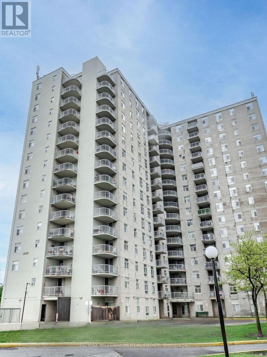 A tall residential building with balconies on each floor.