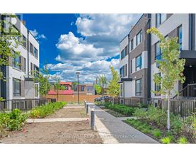 A residential area with apartment buildings and a clear sky.