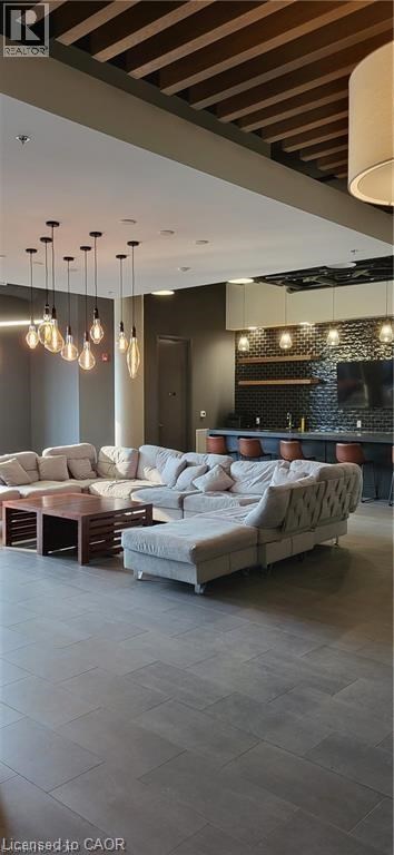 A modern living room with a white sofa and a wooden coffee table.