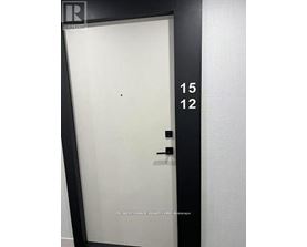 A black door with the numbers 15 and 12 on it.