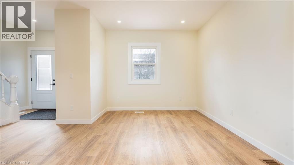 A room with wooden floors and a window.