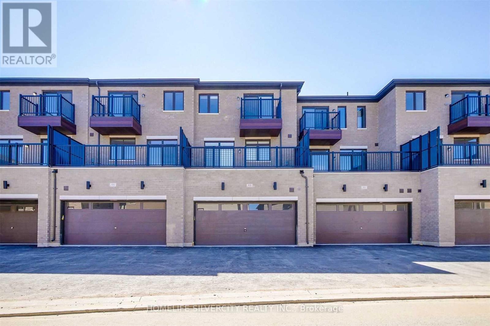 A building with balconies and garages is labeled as a realtor brokerage.