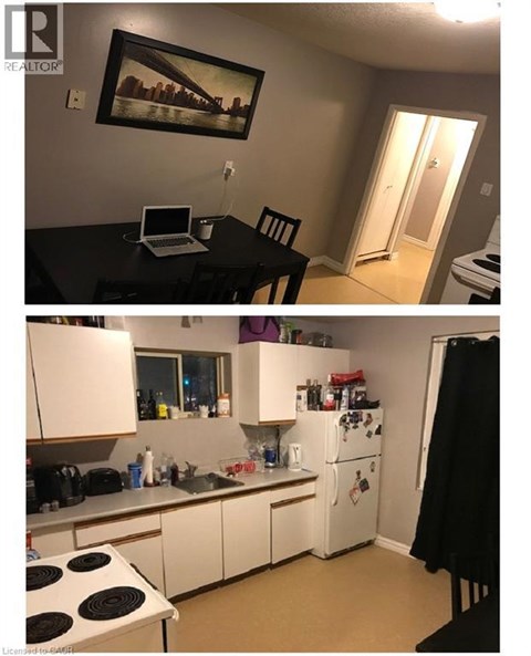 A kitchen with white cabinets and a black stove top.