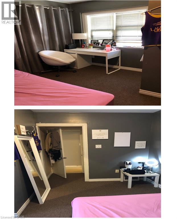 A bedroom with a pink bed and a desk with a chair.