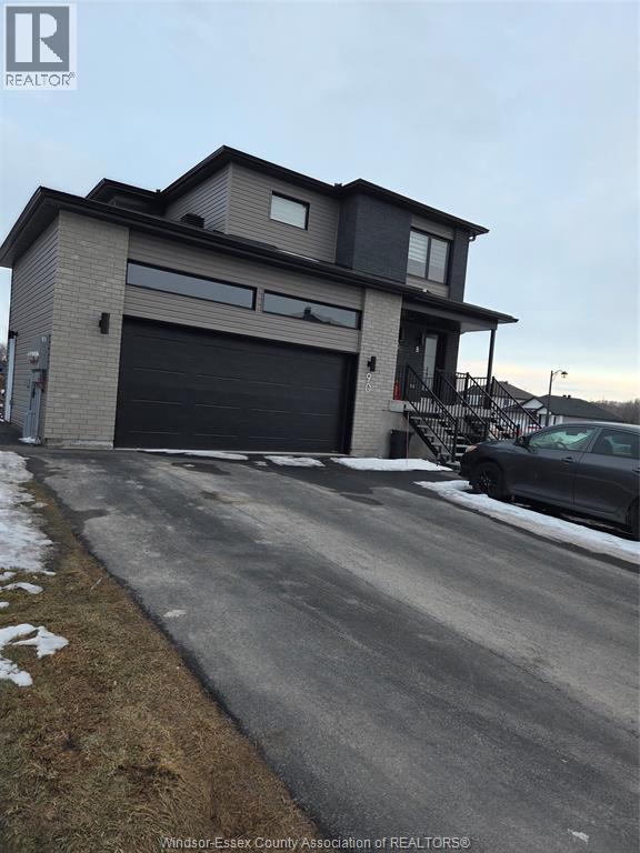 A modern house with a garage is shown in the image.