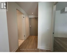 A hallway with a door on the right and a door on the left.
