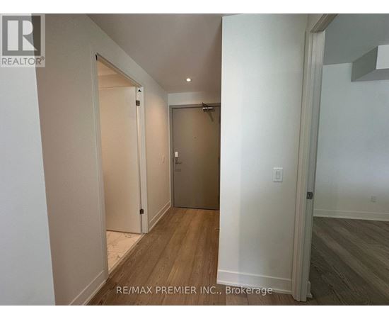 A hallway with a door on the right and a door on the left.