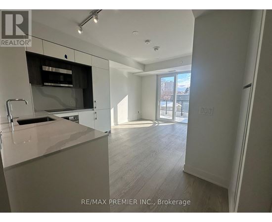 A kitchen with a sink and a counter top.