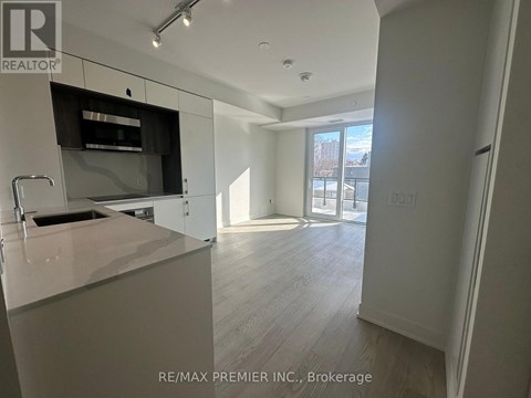 A kitchen with a sink and a counter top.