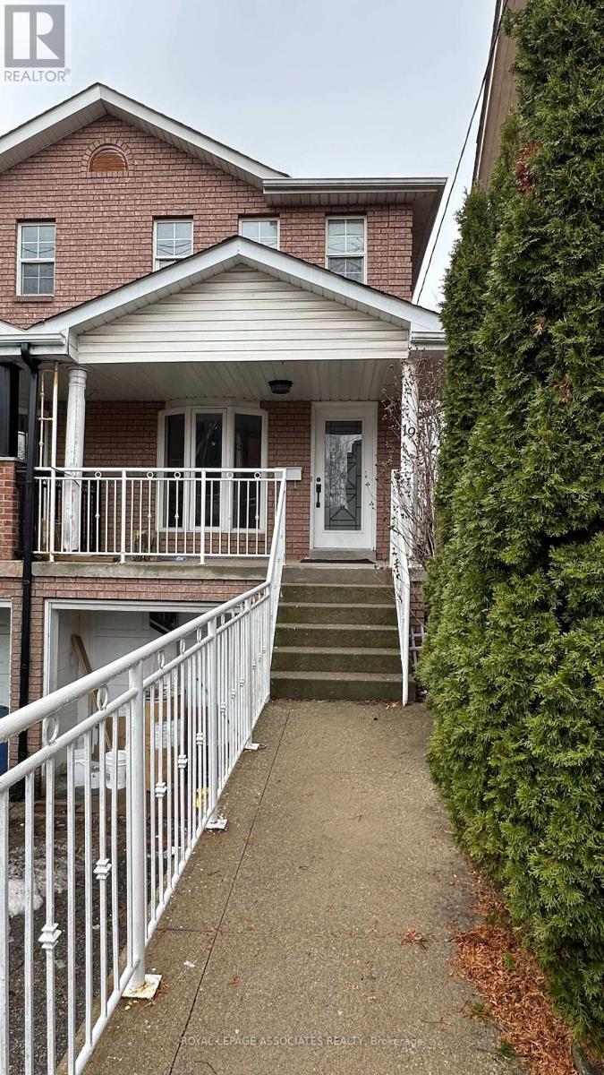 A house with a white fence and a small porch.