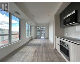 A spacious kitchen with a stove top oven and microwave.