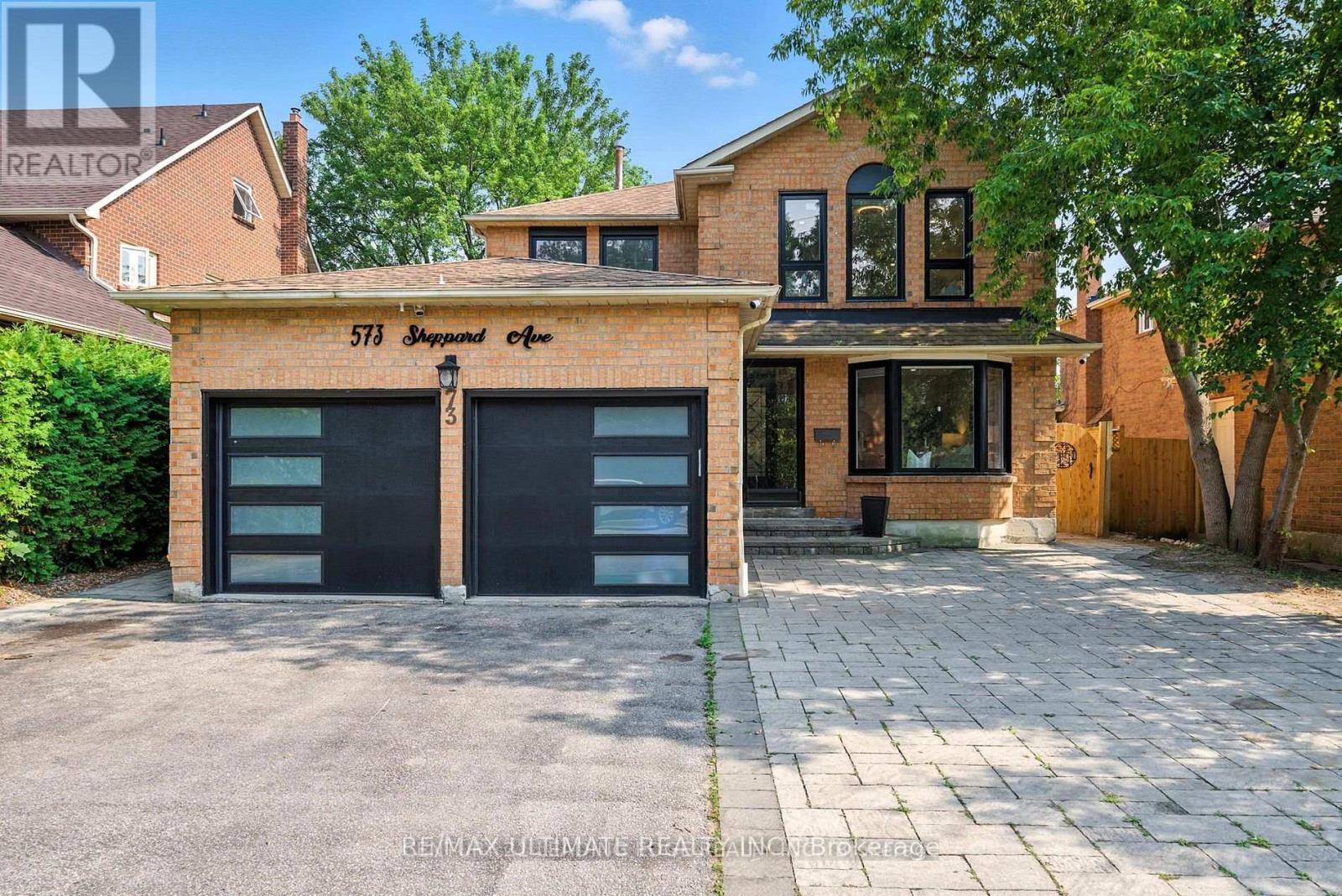 A house with a garage labeled 573 South St.