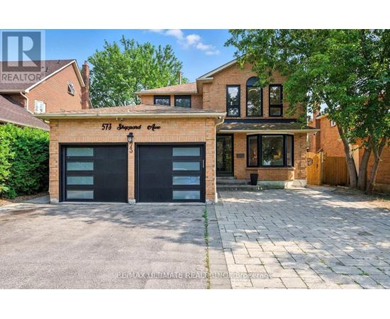 A house with a garage labeled 573 South St.