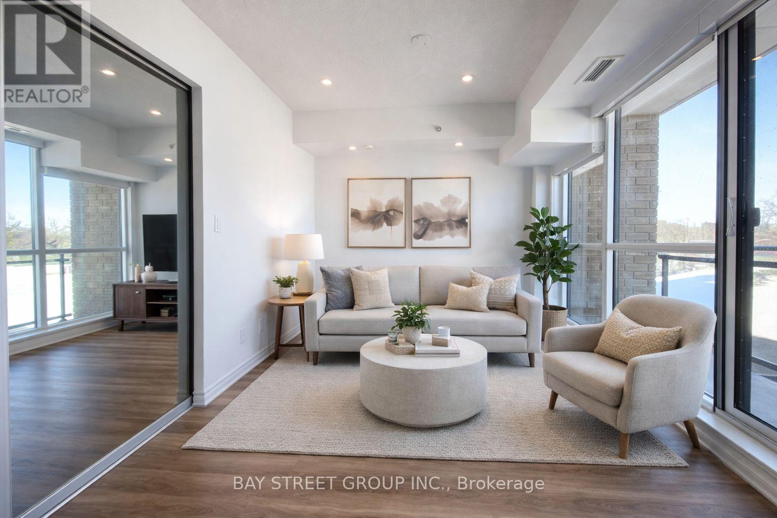 A living room with a couch, chair, and coffee table.
