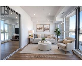 A living room with a couch, chair, and coffee table.