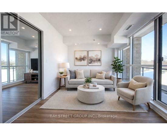 A living room with a couch, chair, and coffee table.