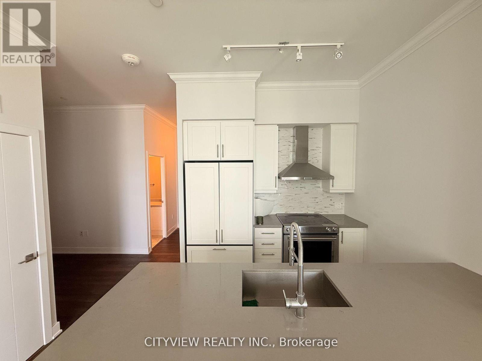 A kitchen with a sink and cabinets.