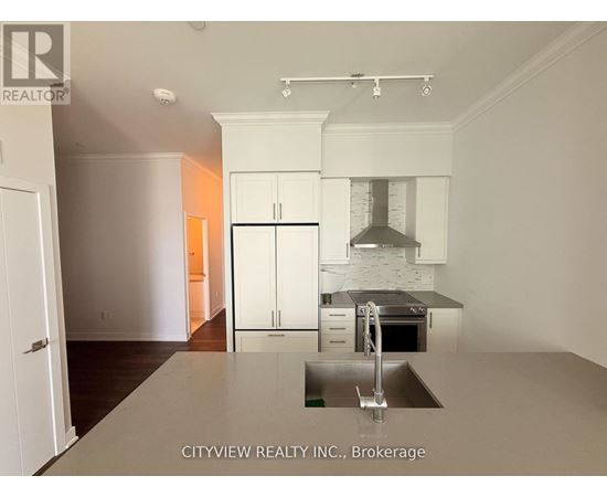 A kitchen with a sink and cabinets.