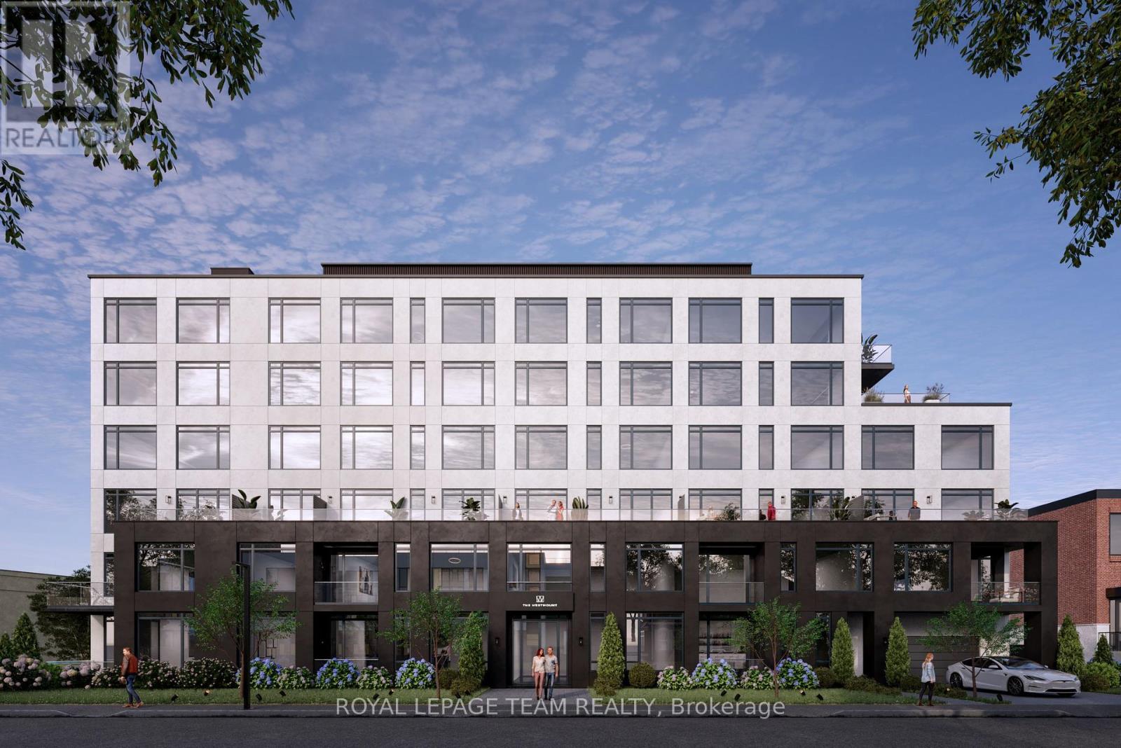 A modern building with a white facade and a brown section at the bottom is depicted.