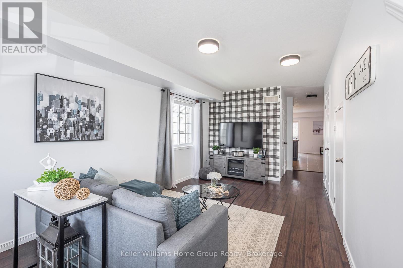 A living room with a grey couch and a coffee table.