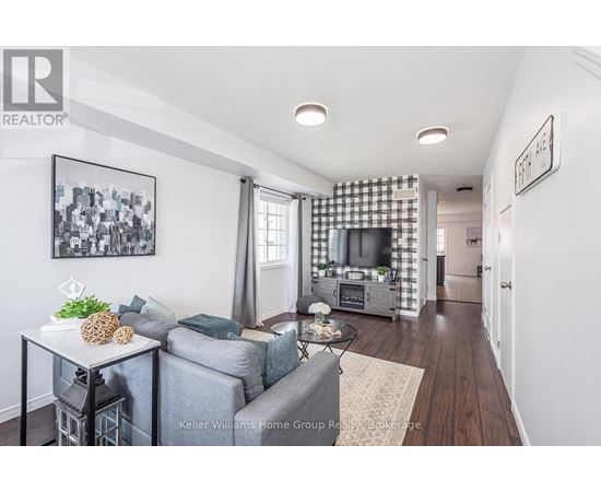 A living room with a grey couch and a coffee table.