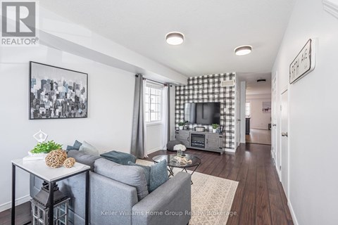 A living room with a grey couch and a coffee table.
