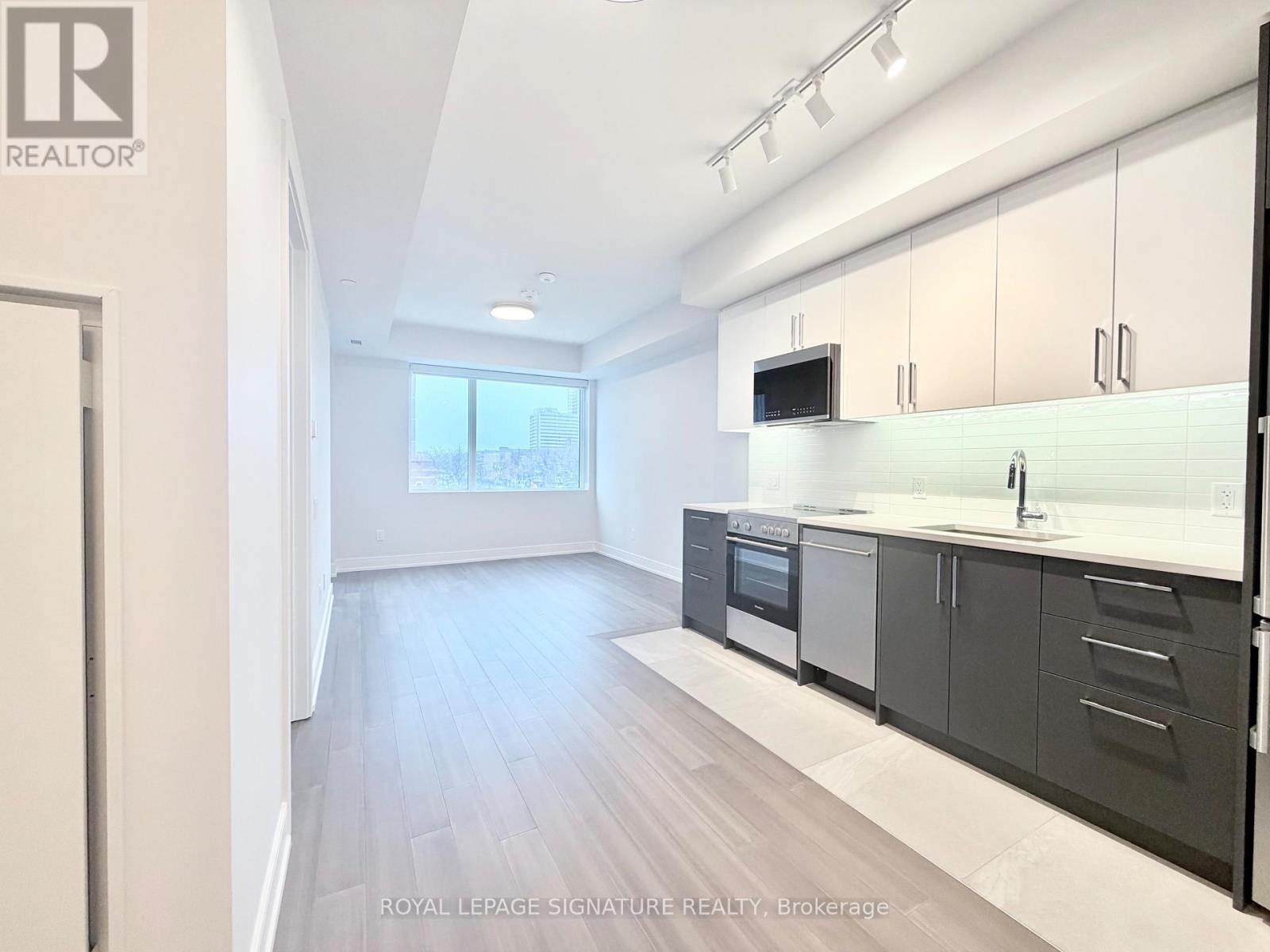 A modern kitchen with a view of the city.