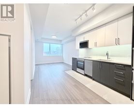 A modern kitchen with a view of the city.