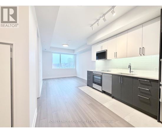 A modern kitchen with a view of the city.