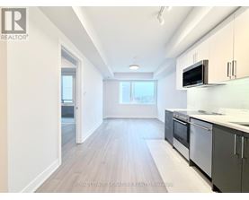 A kitchen with a microwave on the counter.