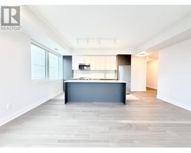 A spacious kitchen with a large island in the middle.