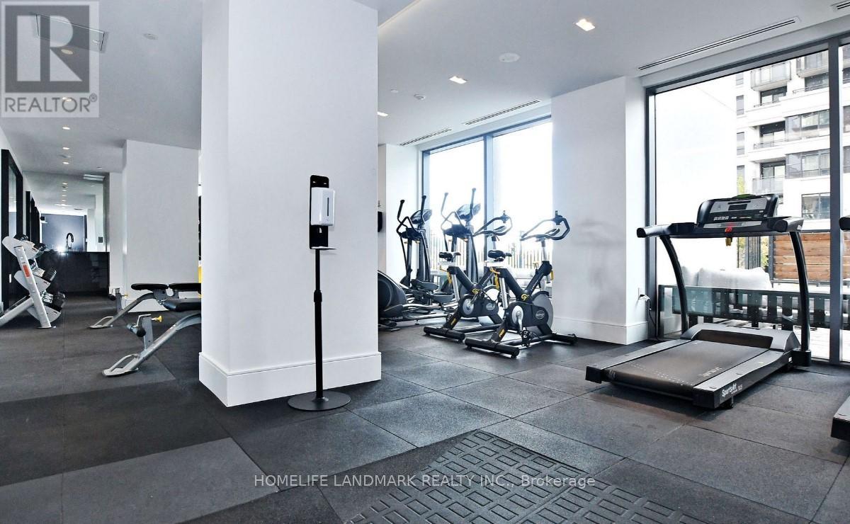A gym with a treadmill, exercise bike, and other equipment.