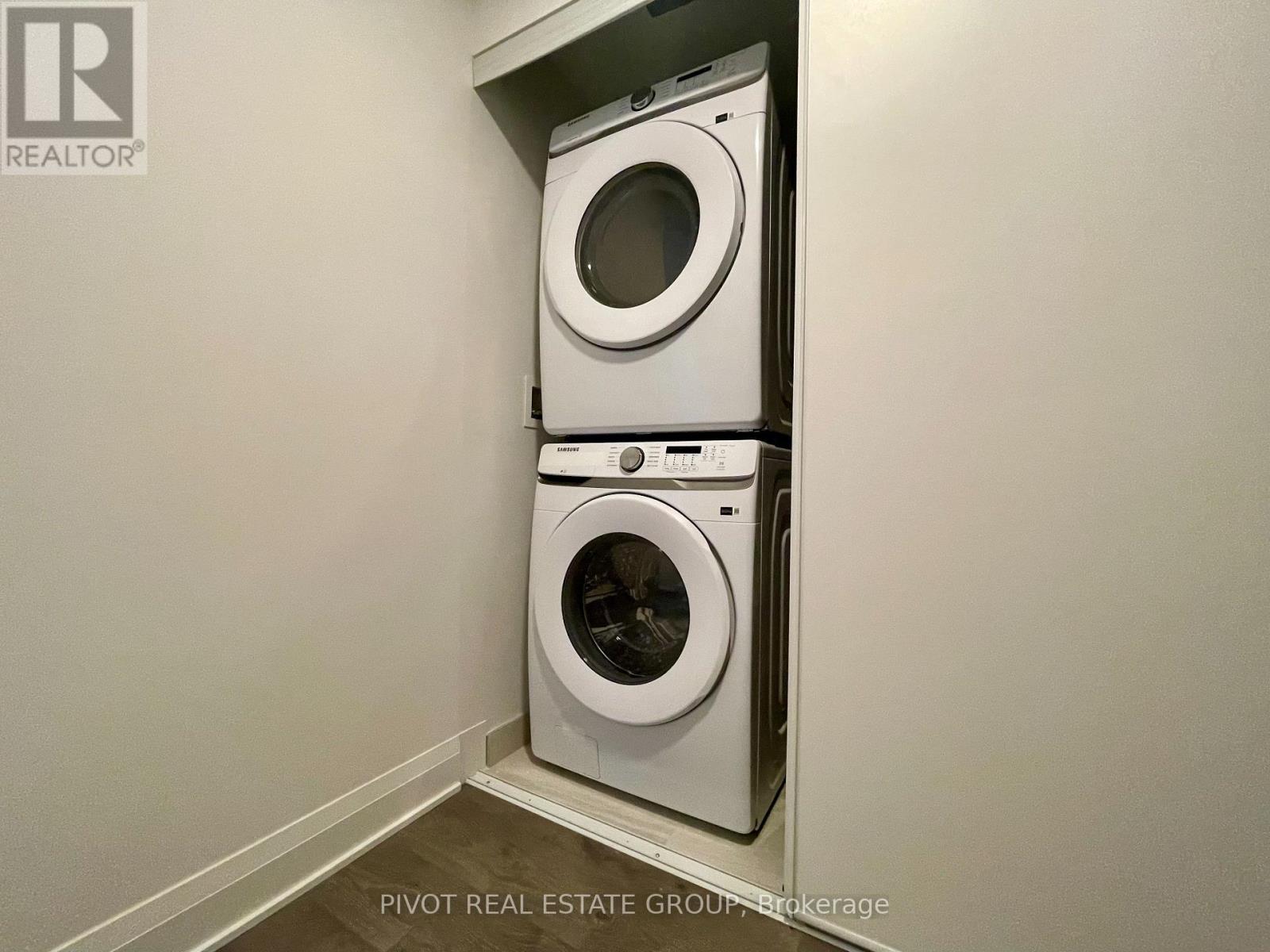 A washer and dryer are stacked on top of each other in a small space.