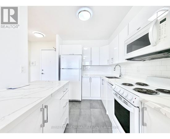 A white kitchen with a stove top oven and a microwave above it.