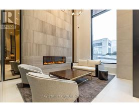 A modern living room with a fireplace and a glass door.