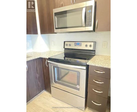 A stainless steel oven with a microwave above it.
