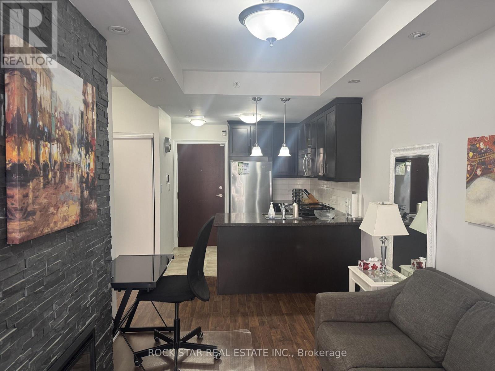A modern kitchen with a dining table and chairs.