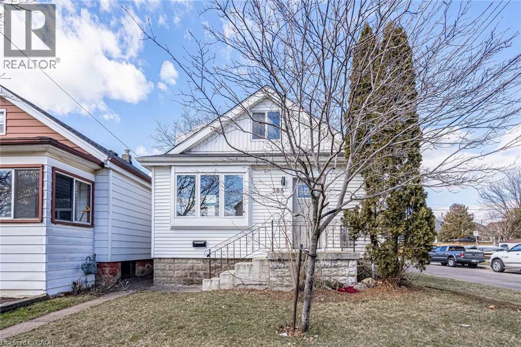 A house with a tree in front of it.