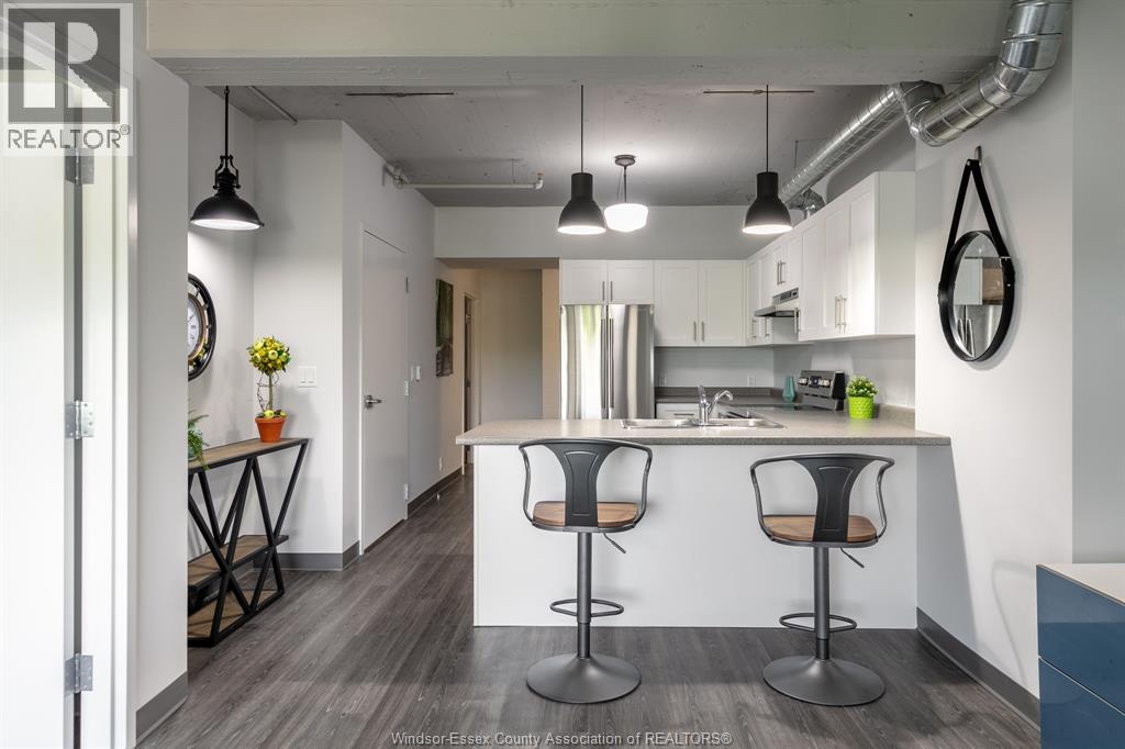 A modern office space with a bar stool in the middle of the room.