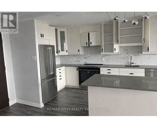 A kitchen with white cabinets and a black dishwasher.