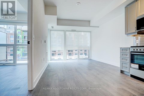 A spacious kitchen with a stove top oven and microwave.
