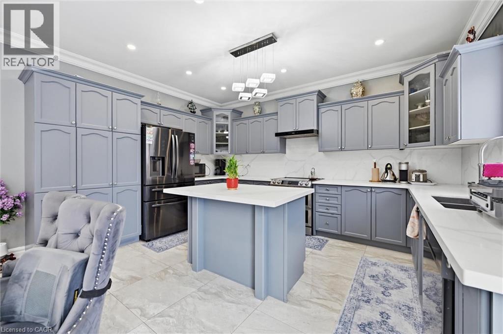 A kitchen with a grey chair and a white counter.