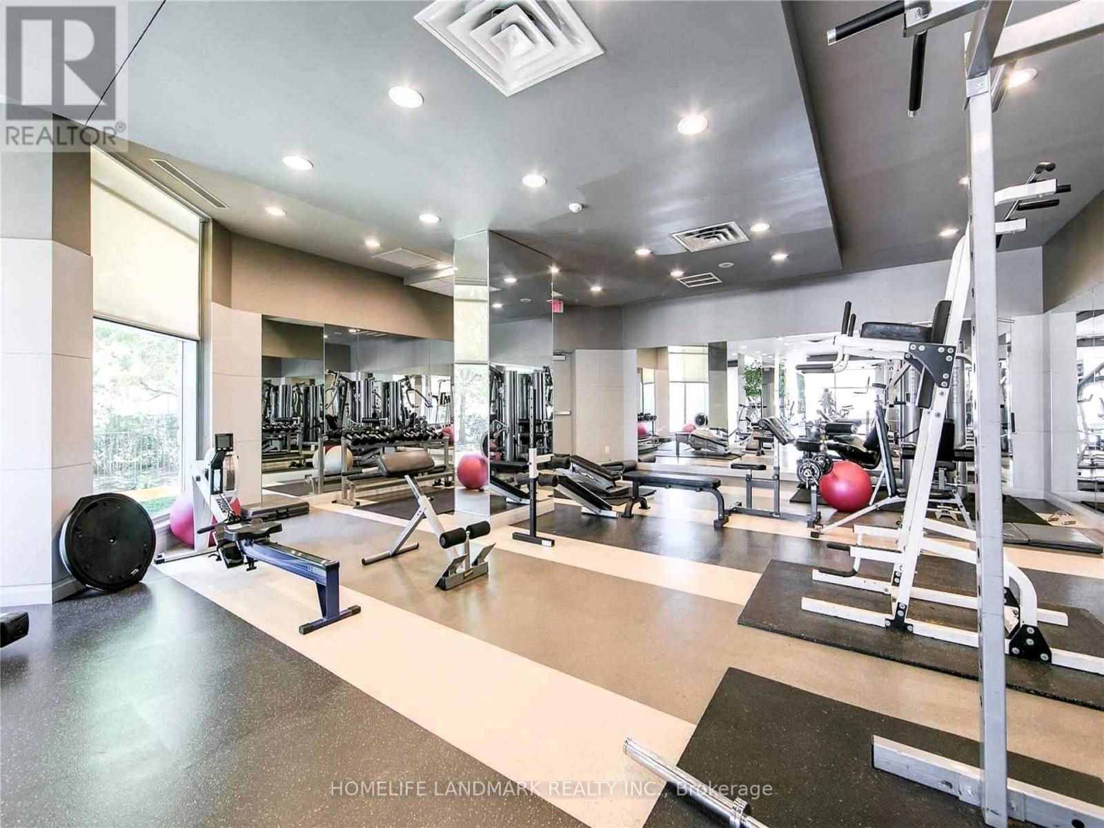 A spacious home gym with a variety of exercise equipment.