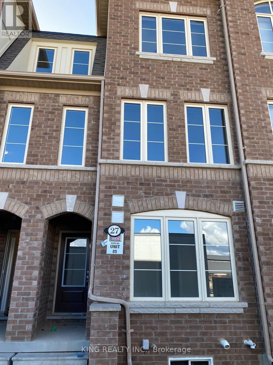 A building with a sign that says "27 UNITS" on it.
