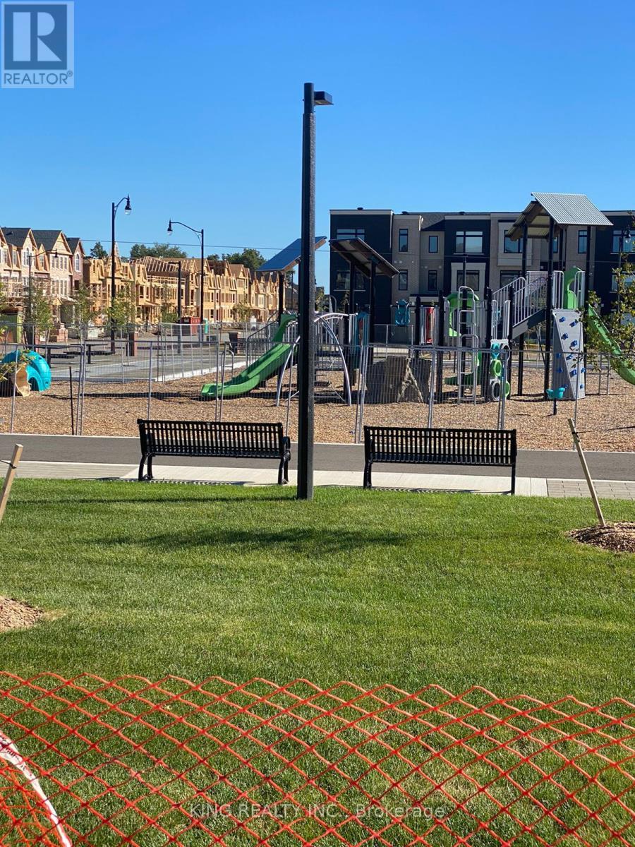 A playground with a slide, swings and a climbing frame.